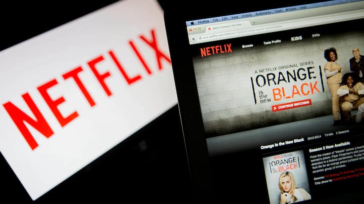 The Netflix Inc. website displays the "Orange is the New Black" series on a laptop computer in this arranged photograph in Washington, D.C., U.S., on Thursday, July 10, 2014. "House of Cards," and "Orange Is the New Black," two Netflix Inc. series that have boosted the popularity of online viewing, will compete for television's top honors as nominees for Emmy awards in drama and comedy. Photographer: Andrew Harrer/Bloomberg via Getty Images