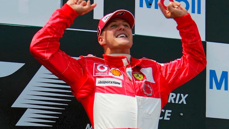 MAGNY-COURS, FRANCE - JULY 4: Michael Schumacher of Germany and Ferrari celebrates on the podium after winning the French F1 Grand Prix at the Magny-Cours Circuit on July 4, 2004, in Magny-Cours, France. (Photo by Clive Rose/Getty Images)