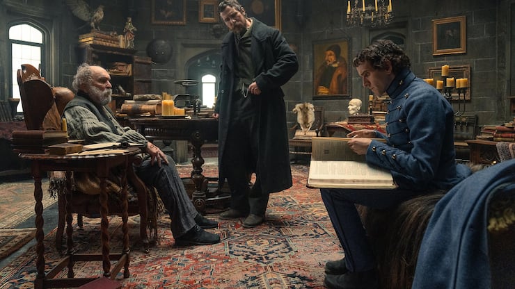 The Pale Blue Eye. (L to R) Robert Duvall as Jean Pepe, Christian Bale as Augustus Landor and Harry Melling as Edgar Allen Poe in The Pale Blue Eye.  Cr. Scott Garfield/Netflix Â© 2022