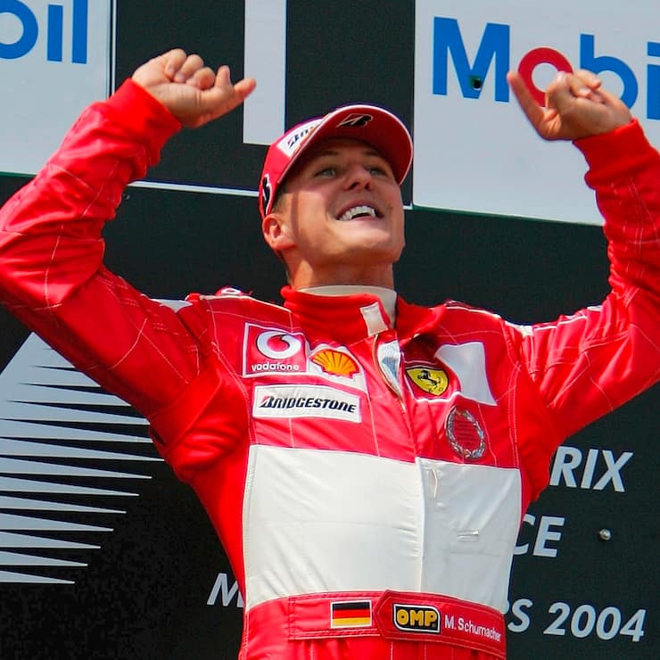 MAGNY-COURS, FRANCE - JULY 4: Michael Schumacher of Germany and Ferrari celebrates on the podium after winning the French F1 Grand Prix at the Magny-Cours Circuit on July 4, 2004, in Magny-Cours, France. (Photo by Clive Rose/Getty Images)