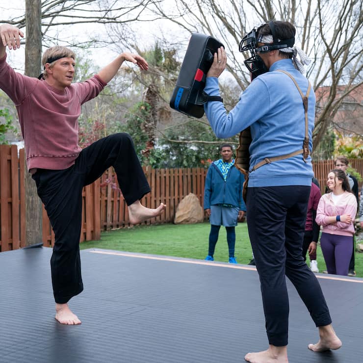 Cobra Kai. (L to R) William Zabka as Johnny Lawrence, Ralph Macchio as Daniel LaRusso in Cobra Kai. Cr. Curtis Bond Baker/Netflix Â© 2021