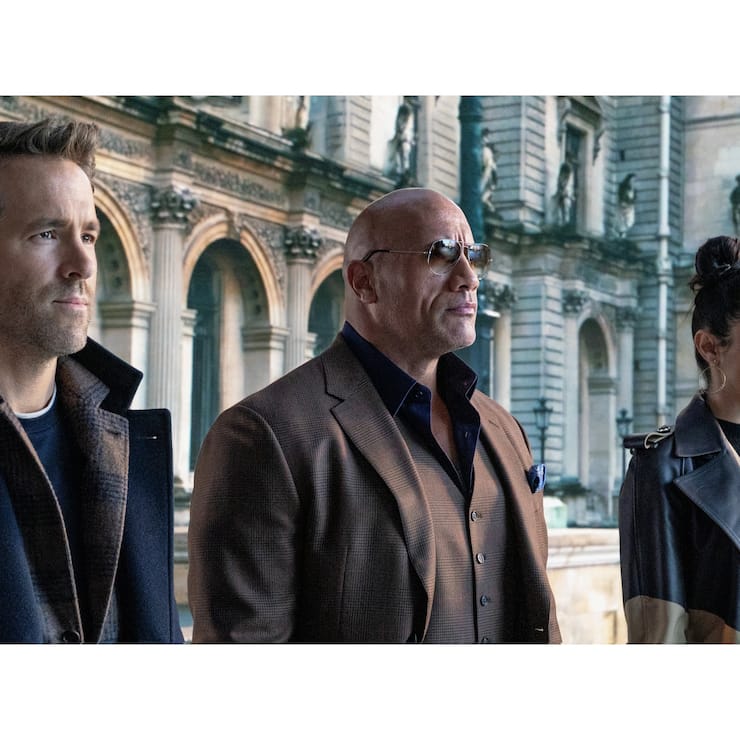 RED NOTICE - (L-R) RYAN REYNOLDS, DWAYNE ï¿¯ï¾¿ï¾¢ï¿¯ï¾¾ï¾ï¿¯ï¾¾ï¾THE ROCKï¿¯ï¾¿ï¾¢ï¿¯ï¾¾ï¾ï¿¯ï¾¾ï¾ JOHNSON, and GAL GADOT STAR IN NETFLIXï¿¯ï¾¿ï¾¢ï¿¯ï¾¾ï¾ï¿¯ï¾¾ï¾S RED NOTICE RELEASING NOVEMBER 12, 2021. WRITTE