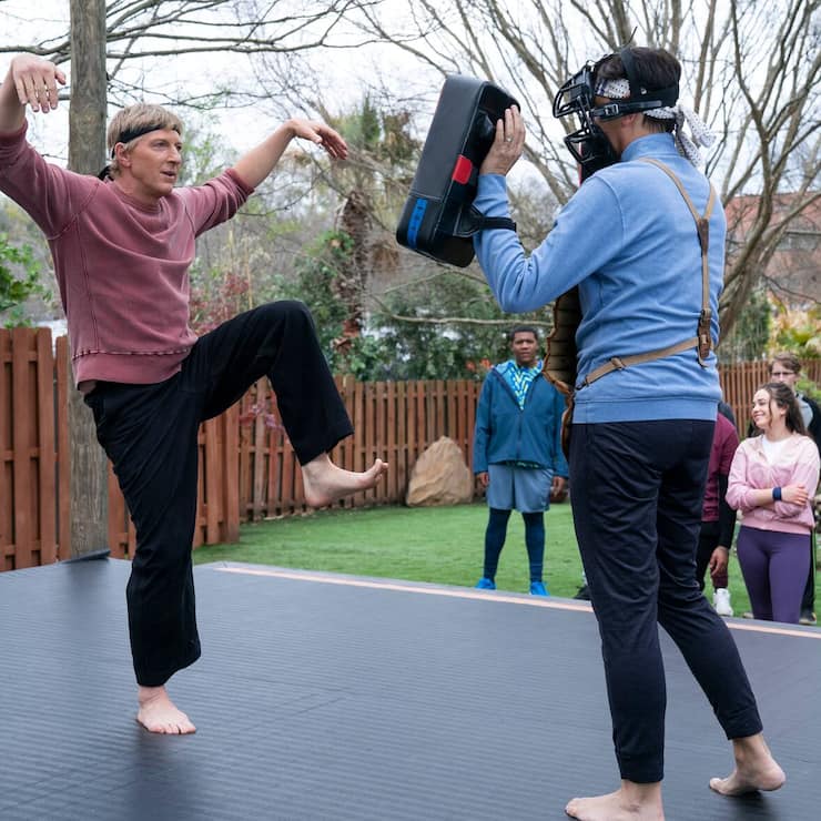 Cobra Kai. (L to R) William Zabka as Johnny Lawrence, Ralph Macchio as Daniel LaRusso in Cobra Kai. Cr. Curtis Bond Baker/Netflix Â© 2021
