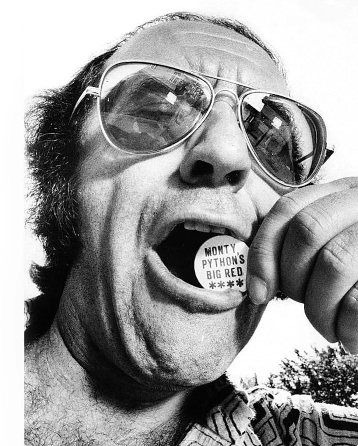 (GERMANY OUT) Biolek, Alfred *10.07.1934- Moderator, Fernsehkoch, Jurist, Dbiting on a coin with the inscription "Monty Python's Big Red"- no date (about 1970) (Photo by Rainer Binder/ullstein bild via Getty Images)