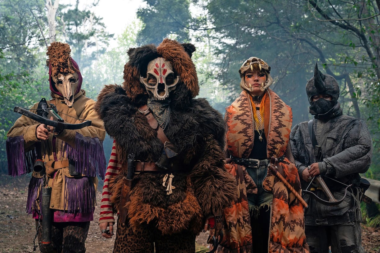 SWEET TOOTH (L to R) ANIMAL ARMY MEMBER, STEFANIA LAVIE OWEN as BECKY, MIA ARTEMIS as TIGER and ANIMAL ARMY MEMBER in episode 103 of SWEET TOOTH Cr. KIRSTY GRIFFIN/NETFLIX Â© 2021